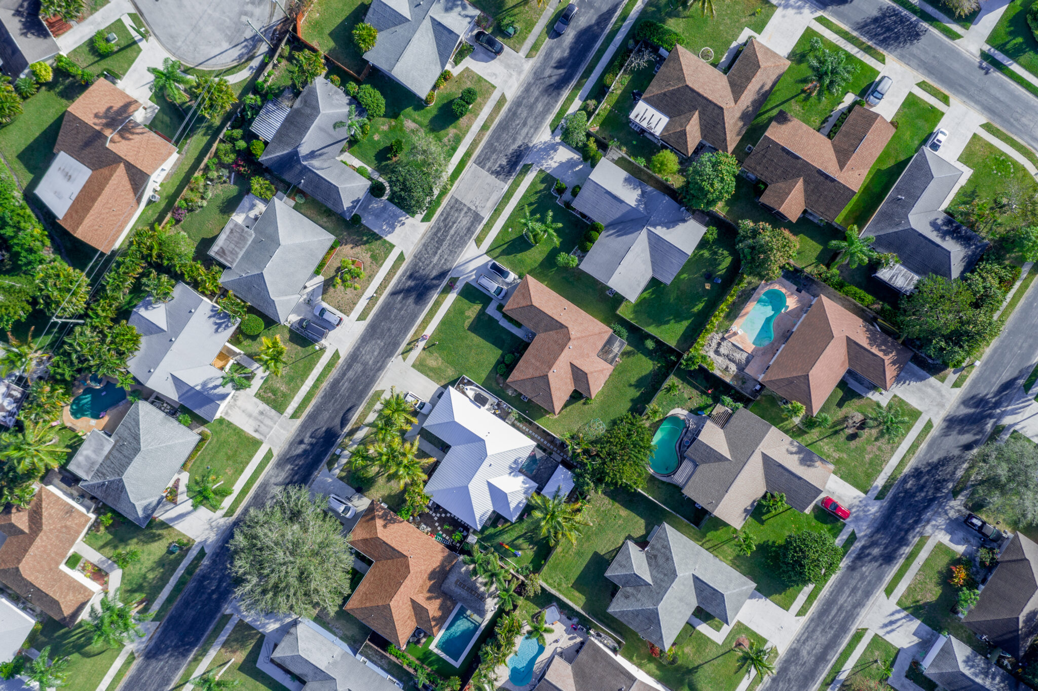 Aerial,Summer,View,Of,Warm,Sunny,Neighborhood,Community,Roofs,With ...